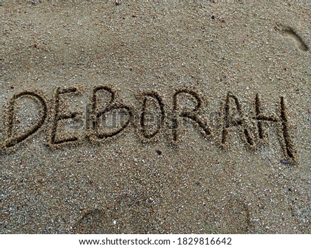 A name written on the beach sand
