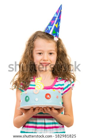Cheerful little girl holding birthday cake isolated on white background