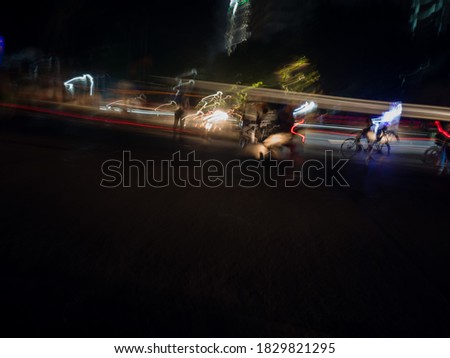 Light painting created through various light sources  residents vehicles headlight to brake light and street lamp and police light and  historical place lighting colorful vehicle  ambulance crane 