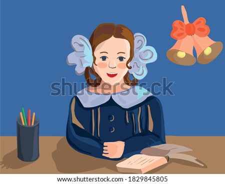 schoolgirl with bows at the desk on the table are stationery