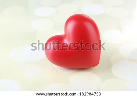 Red heart on light background