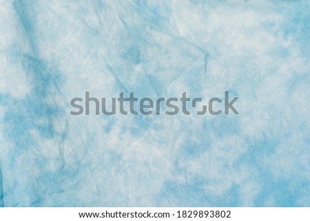 Abstract stained blue color tones background. Watercolor light and  blue and white color wallpaper, abstract fabric surface design