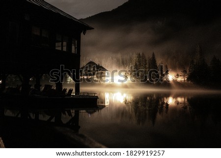 Lake House during night with lights 