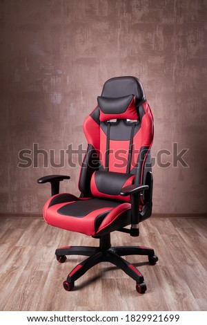 black and red comfortable gaming chair. furniture for computer gamers. Royalty-Free Stock Photo #1829921699