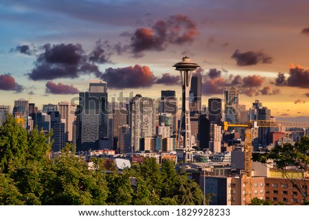 Seattle City Skyline, Washington, United States of America. Modern American City on the West Coast during a Sunny and Cloudy Sunset. Artistic Render