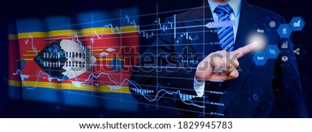 Businessman touching data analytics process system with KPI financial charts, dashboard of stock and marketing on virtual interface. With Swaziland flag in background.