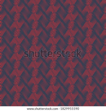 Blurred decoration, in blue and red, made of simple geometric elements, arranged in columns. Tapestry background. Upholstery texture.