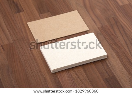 Business card mockup, eco paper on wooden table