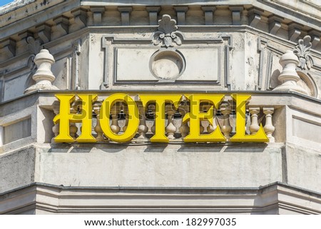 Yellow Hotel Sign Close Up On Building