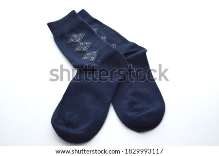 An image of a pair of sock isolated in white background. Selective focus image. 