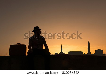 man in front of boston city skyline