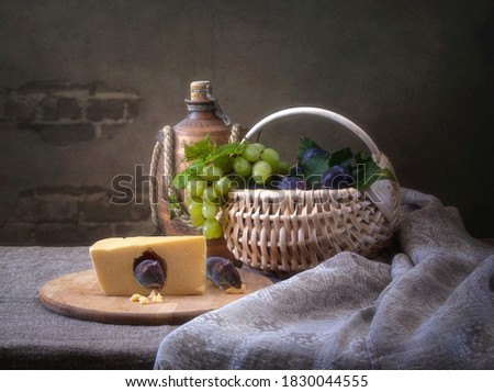 Still life with piece of cheese and mouse in hole