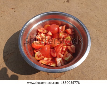 Fresh tomato salad in bowl.
sliced of  tomato Ready for cooking. A beautiful picture of red tomato. Most popular vegetable of all over world. Tomato Salad. 