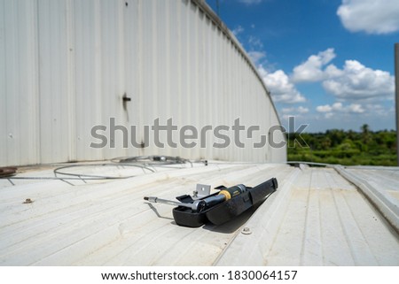 installing tools for metal sheet solar rooftop and grounding system stock photo