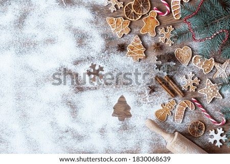 Christmas homemade gingerbread cookies on wooden background top view with copy space. Christmas home baking.