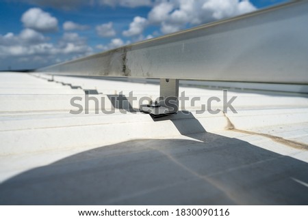 installing metal sheet bar frame and grounding system stock photo
