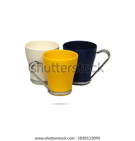 Multi-colored and conical shaped ceramic, glass or plastic cups, mugs isolated on white background. Porcelain, ceramic or plastic set of cups for your brand design. Metal handed cups.
