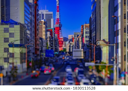 A miniature traffic at the urban street behind Tokyo tower tiltshift. Minato district Tokyo Japan - 09.28.2020 : It is a center of the city in tokyo.