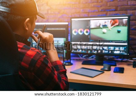 Asian creative man and editor video work Vlogger editing video create content for upload on social media or internet online connect communication people ware global.