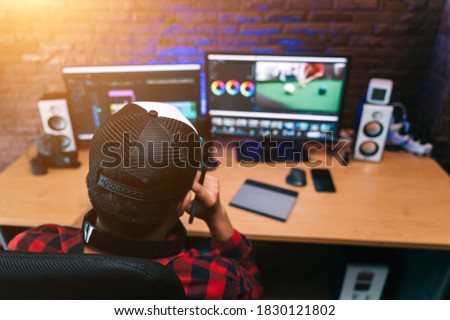 Asian creative man and editor video work Vlogger editing video create content for upload on social media or internet online connect communication people ware global.