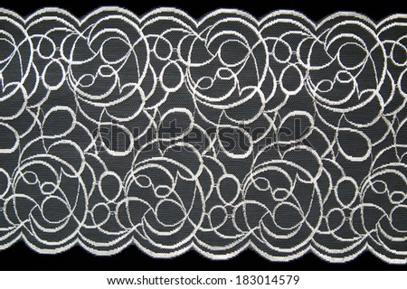 White lace pattern on black background