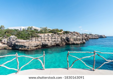 Turquoise waters of Cala en Brut, beach of Minorca, Balearic Islands in Spain Royalty-Free Stock Photo #1830163091
