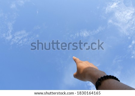A Man Hand Position and try to touching the sky