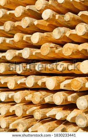 Background with a freshly made wooden columns. Columns are used for installing fences.