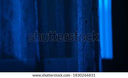
Blue window with woman looking