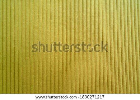 closeup yellow color textured fabric surface