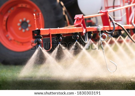 Nozzle of the tractor sprinklers sprayed. Royalty-Free Stock Photo #1830303191