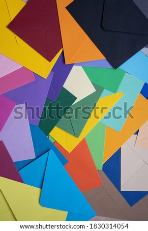 colored envelopes on the table in the form of a mosaic