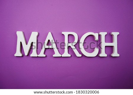 March alphabet letter with space copy on Purple background