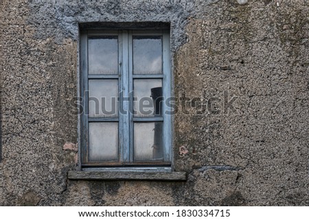 small window in an old house in italy