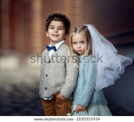 boy and girl dressed as bride and groom, picture with
noise effect