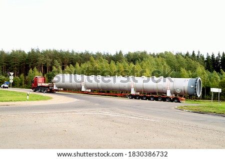 pictured truck transporting bulky long loads