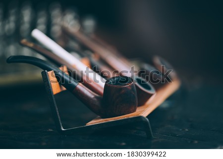 Pipe collection for man with style.  Royalty-Free Stock Photo #1830399422