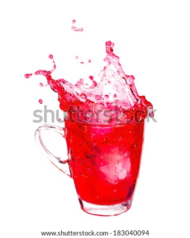 Splashing of red soda with ice in glass on white background.