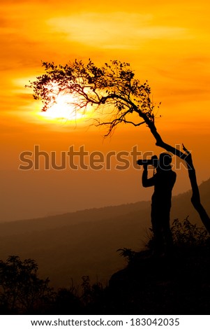 silhouette of the photographer with the evening light.