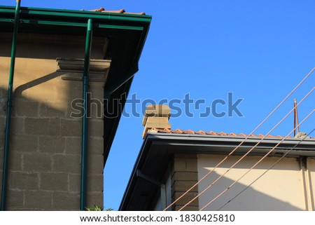Image of Two Roofs and Cables