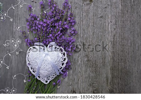    Bouquet of lavender   with heart on wooden background                          
