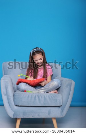 positive girl posing on the sofa