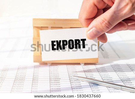 export word on paper over office table in male hand.