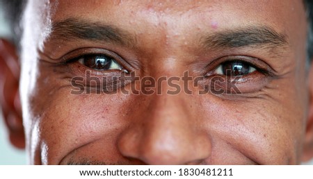 Close-up face african descent closing and opening eyes, smiling reaction Royalty-Free Stock Photo #1830481211