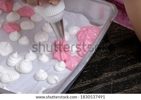 sigh or homemade meringue, a sweet made from egg white and sugar
