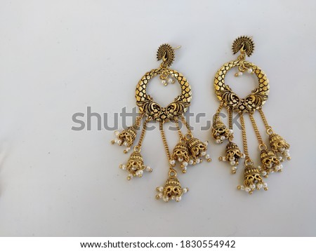 uttarakhand,india-3 may 2020:this is a picture of ear rings on white background.these are made of metal.