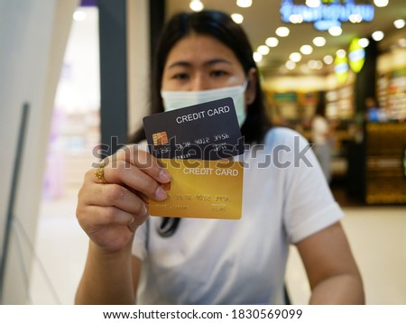 woman is holding credit card and showing,shopping concept.