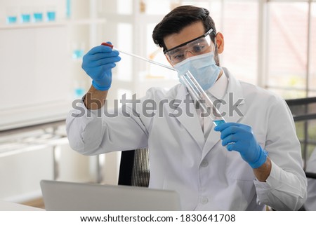 Health care researchers working in life science laboratory. Male research scientist and supervisor preparing and analyzing in research lab. Invention of the coronavirus vaccine