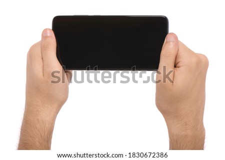 Man hand holding the black smartphone with blank screen. isolated on white background. High resolution photo. Full depth of field.