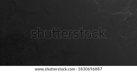 Portoro marble floor and wall tile. black onyx marble texture background. black calacatta marbl wallpaper.  black emperador marbel texture.  natural marbelling granite stone. travertino marbel.  Royalty-Free Stock Photo #1830696887
